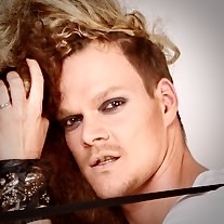 model with punk look staring unsmiling into camera. this photo acts as a a to the image profile of Jeanette Skibbe